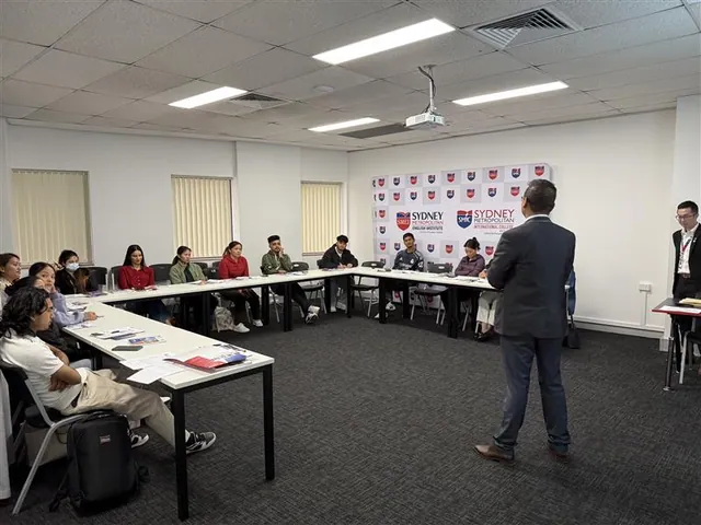 Students and staff at a SMIC orientation session — photo 3