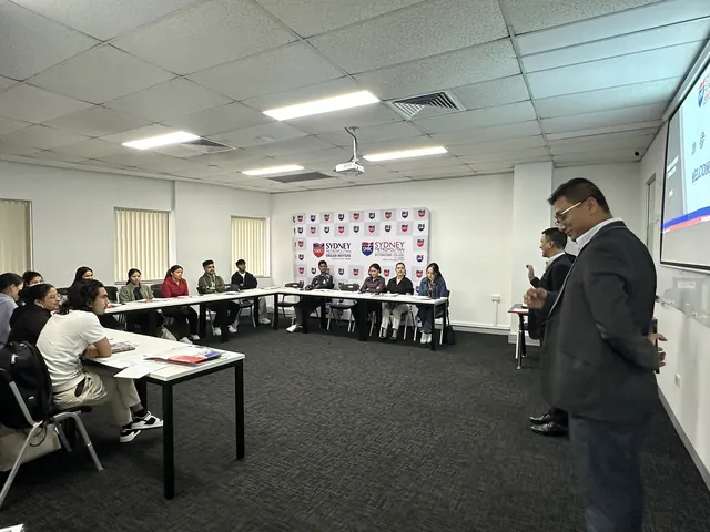 Students and staff at a SMIC orientation session — photo 5