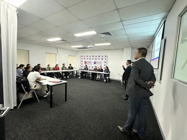 Students and staff at a SMIC orientation session — photo 6